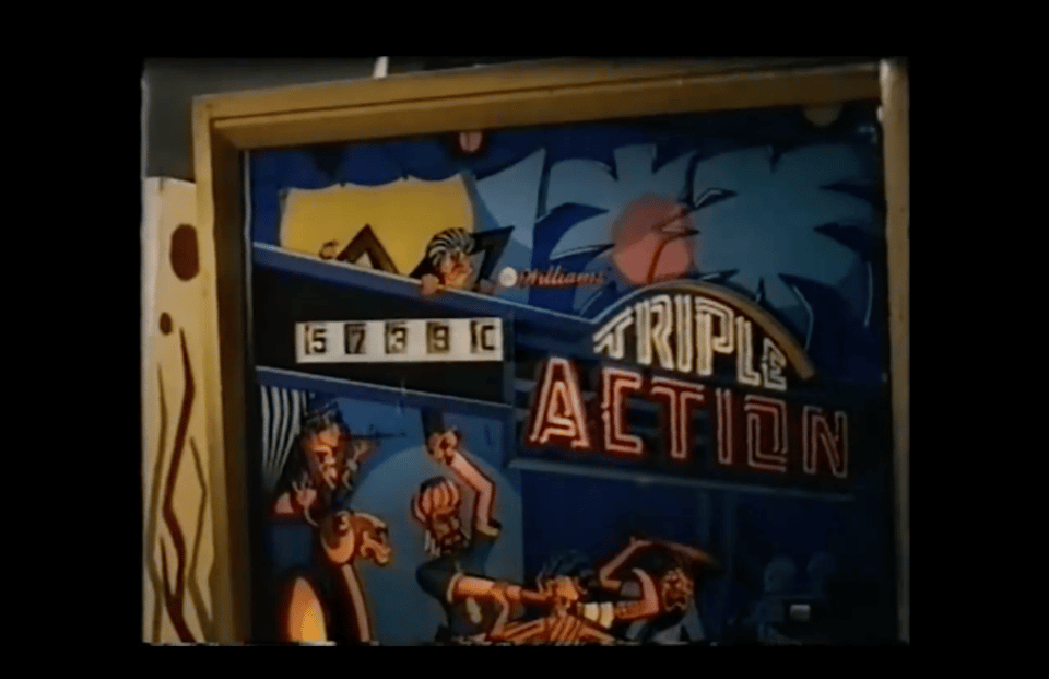 A backbox of an old pinball machine called Triple Action