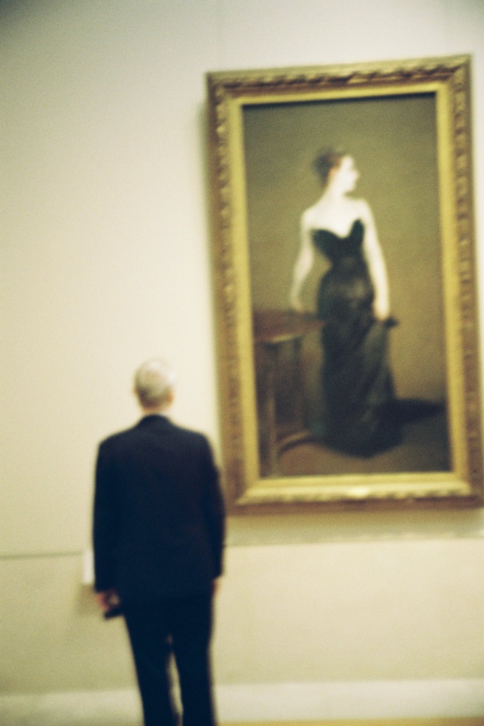 Madame X at the Met, in a 35mm, blurry photo capture.