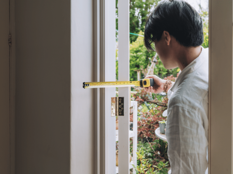 Retrofit assessor taking measurements