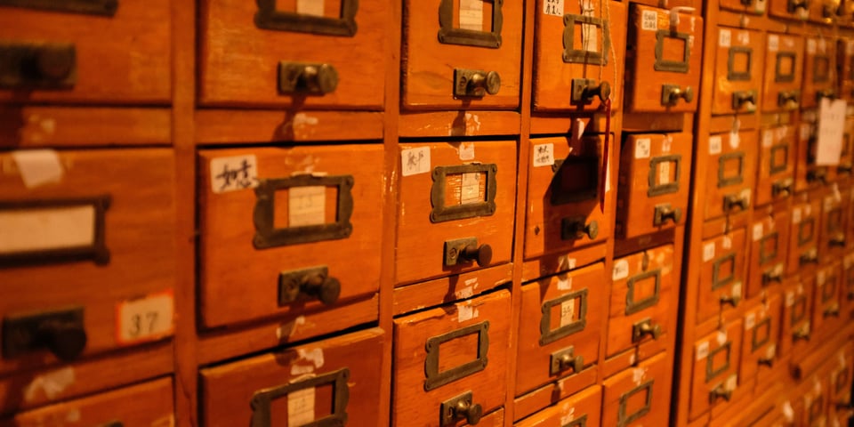 A whole row of tiny filing drawers.