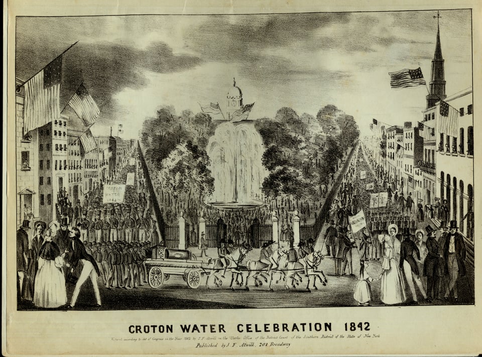 Paraders marching on either flank of City Hall Park in New York, where at center water streams out of a large fountain.