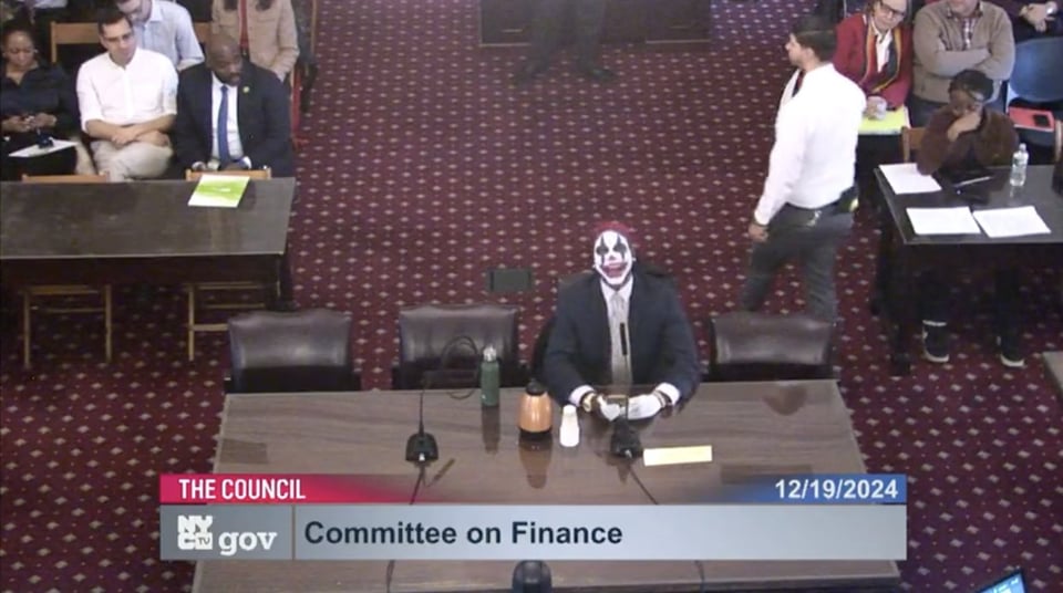 Paperboy Love Prince cackles at a NYC council meeting
