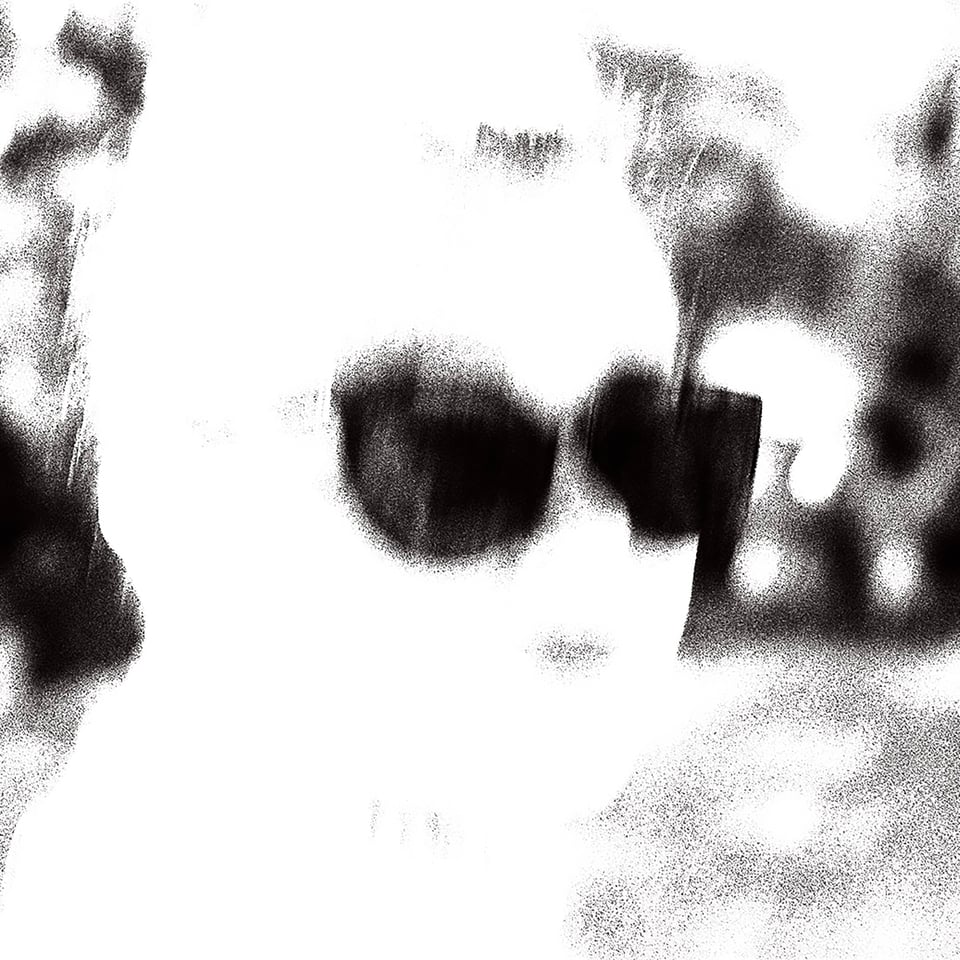 a blown out monochrome image of a person in sunglasses.