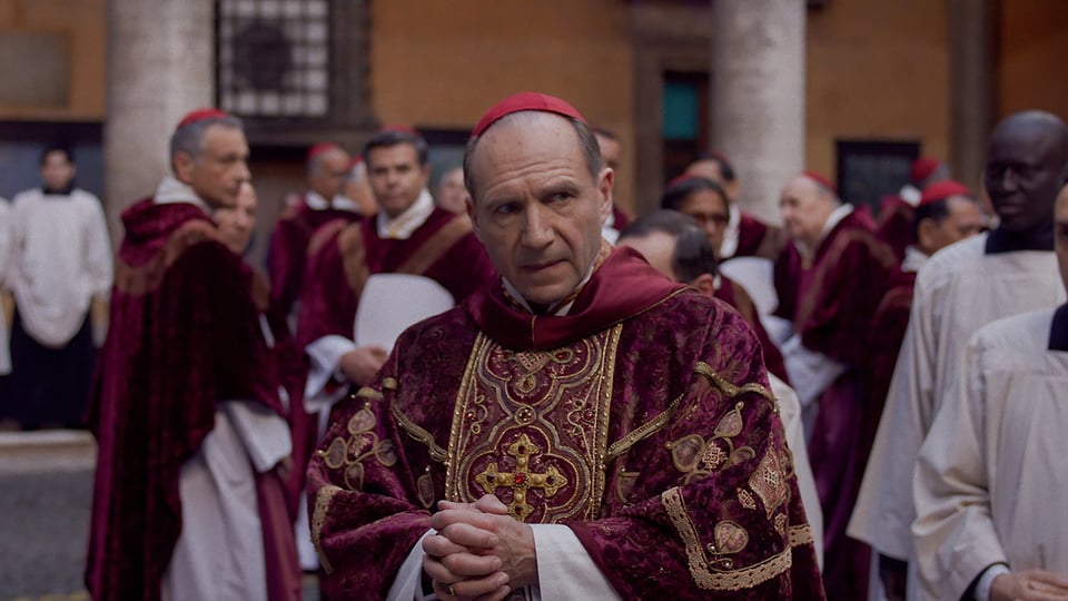 A scene of Conclave with Lawrence among the cardinals.