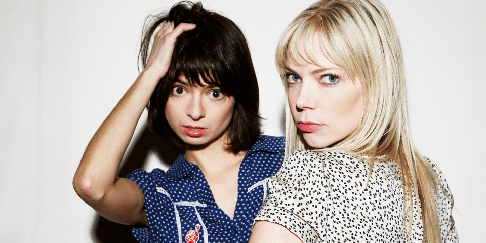 Kate Micucci and Riki Lindhome pose for the camera.