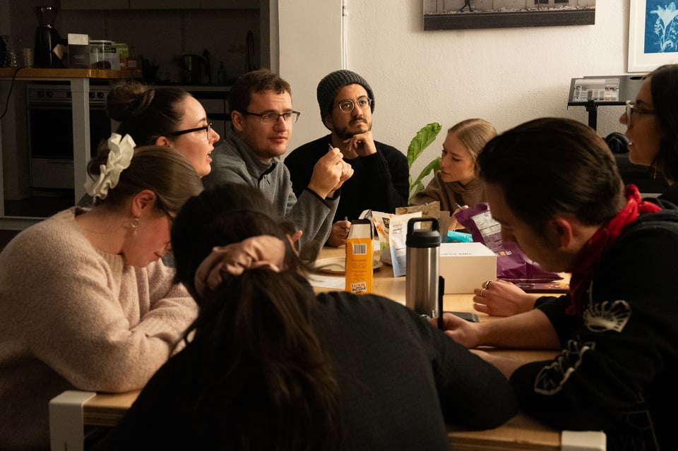 A group sitting around a table.