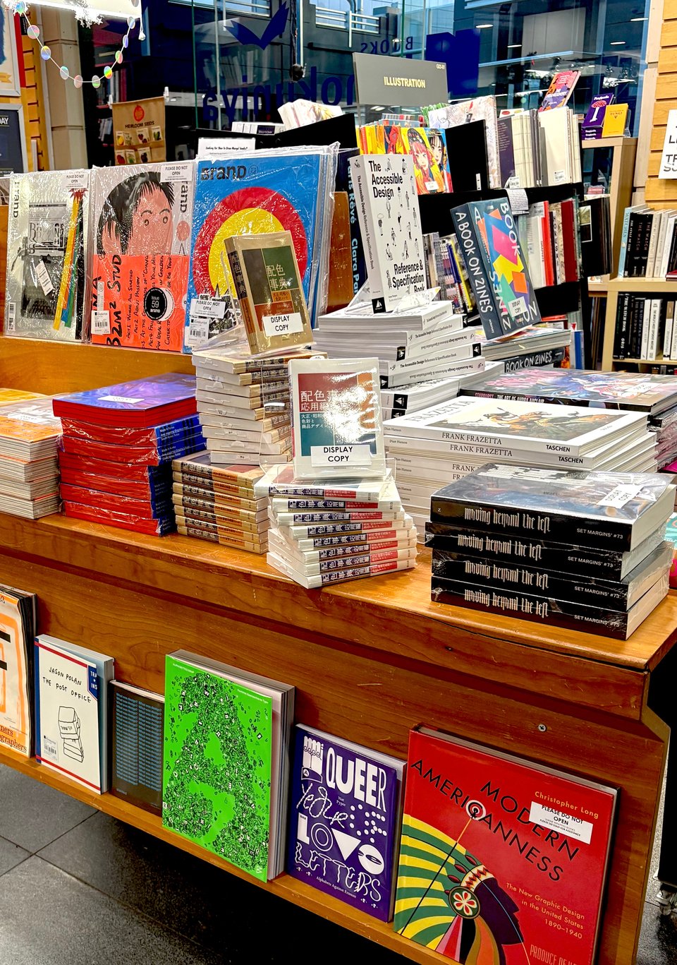 a table of books at a bookstore featuring a range of books in all colors and sizes
