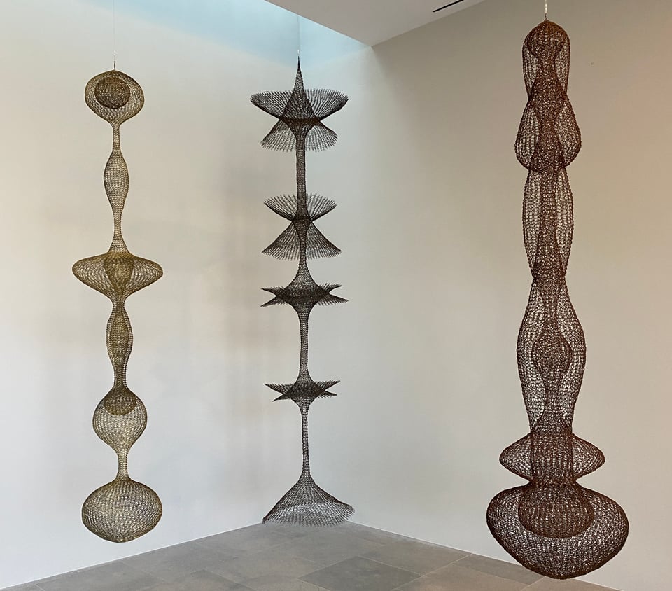 Three very tall hanging abstract wire scultpures