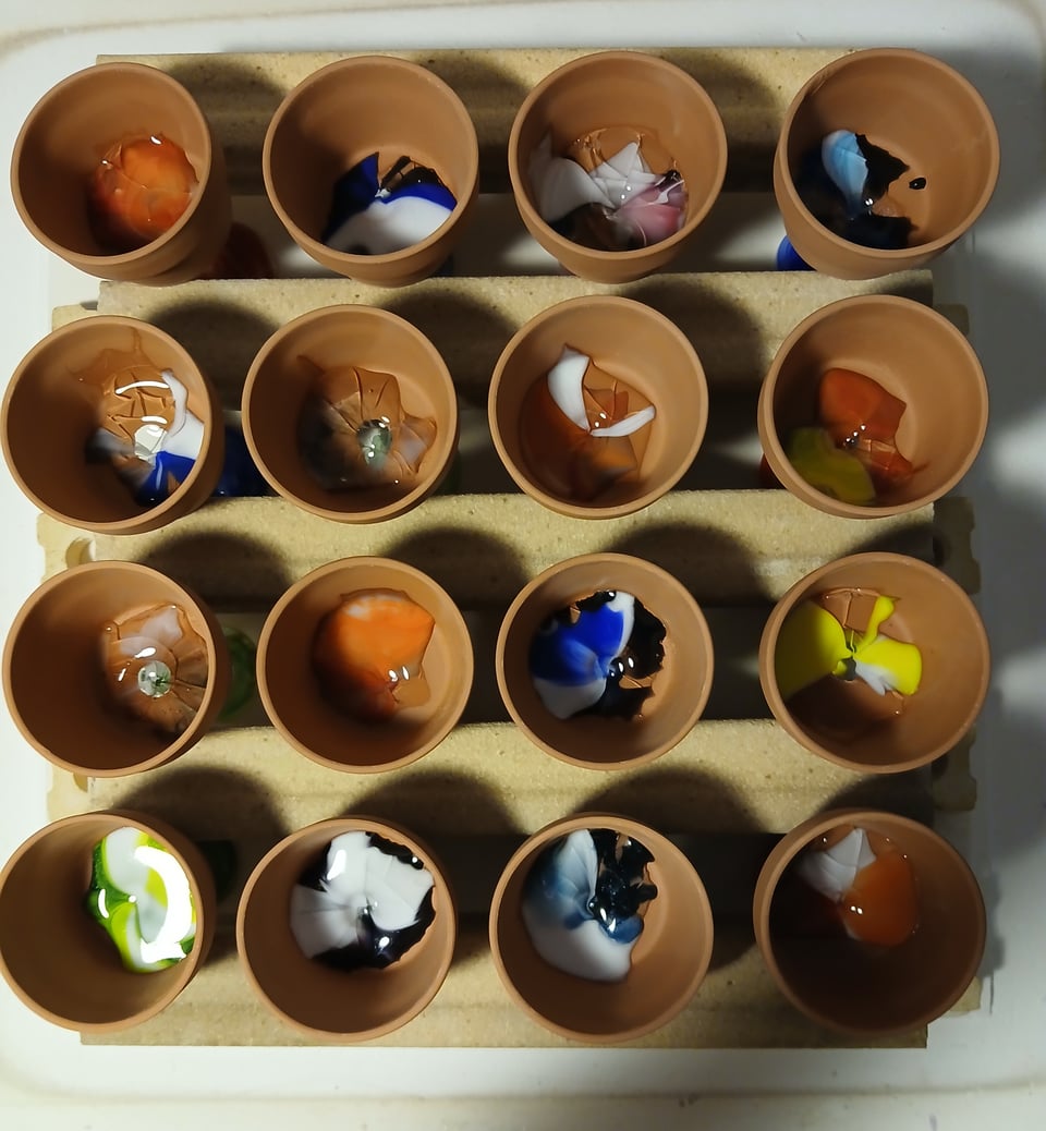 the pots have melted glass in them