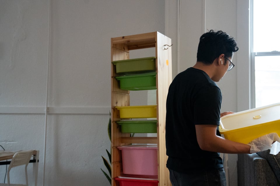 Norton cleaning out some drawers.