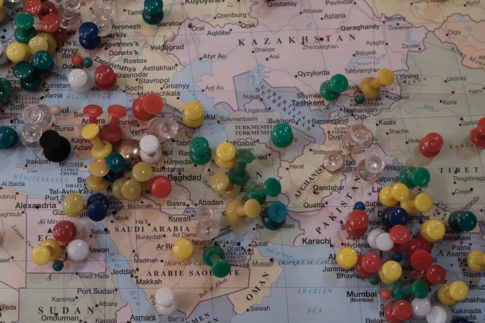 A map of the Middle East with pins in it.