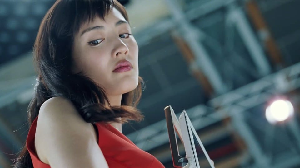 A low-angle shot of Haruka Ayase. She appears to be sneering contemptuously at something just to the left of the camera.