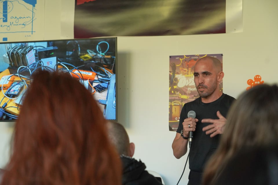 A presenter talking in front of an audience