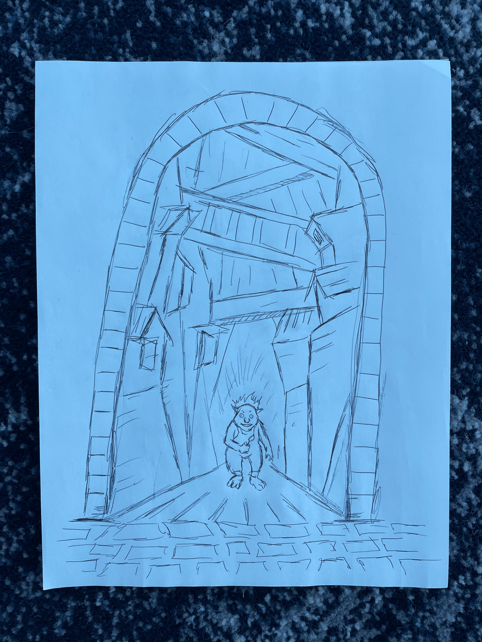 A crooked archway leads to an alley of titling wooden buildings. A small troll holds a lit match