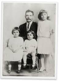 Harry Margolin in 1913 with his children, from left, Bessie, Jacob and Dora. Harry’s wife, Rebecca, had died the year before. He put the children in an orphanage.
