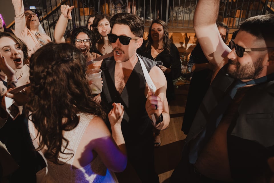 a bride and groom dancing at a wedding