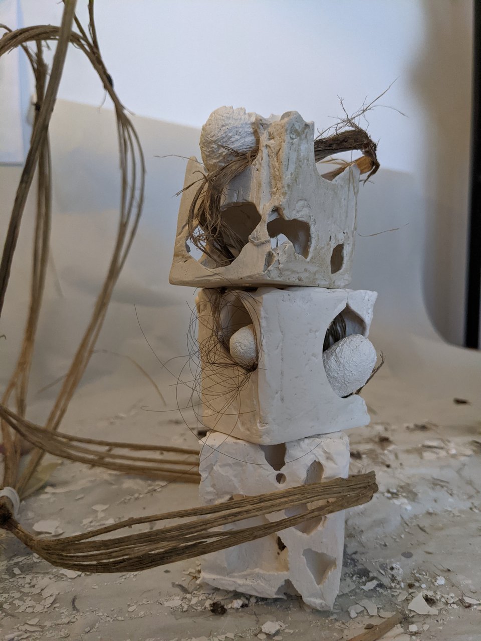 Bone cubes with bark fiber, hair, plaster orbs
