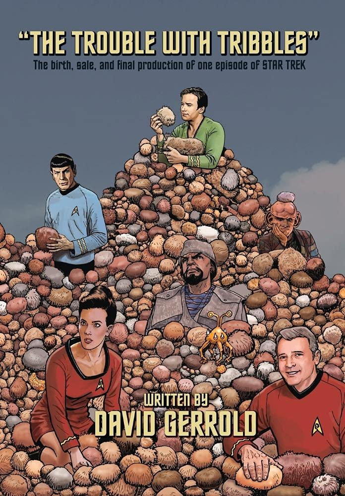 One cover for "The Trouble with Tribbles: The Birth, Sale, and Final Production of One Episode of STAR TREK" by David Gerrold, depicting classic characters from the original STAR TREK and START TREK: DEEP SPACE NINE standing in piles and piles of fuzzy little tribbles.