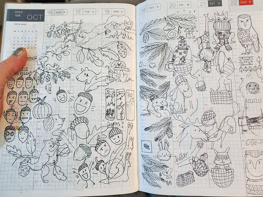 A two page spread covered in pen and ink sketches of acorns, squirrels, deer, rabbits, owls, cats, leaves, YOU NAME IT. If it's a cozy autumnal animal or object, it's scribbled somewhere on these pages.