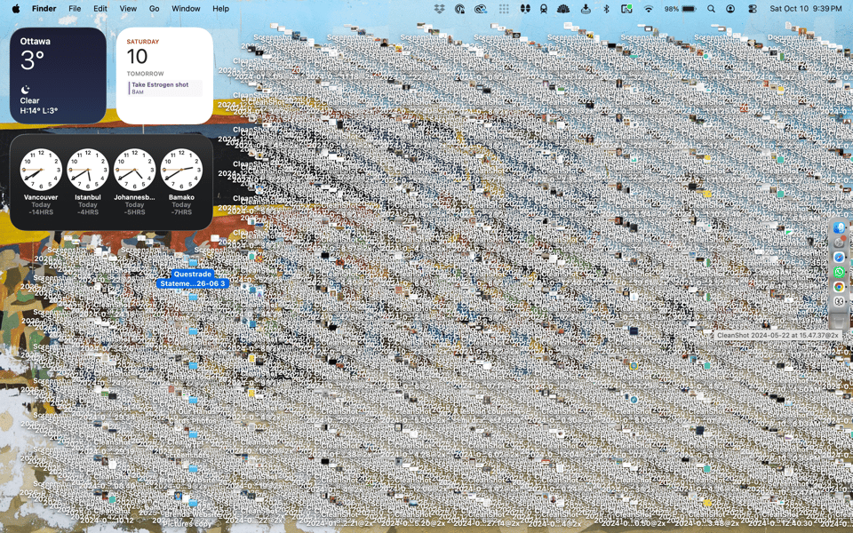 a screenshot of my laptop desktop, completely covered in several layers of screenshots and downloads