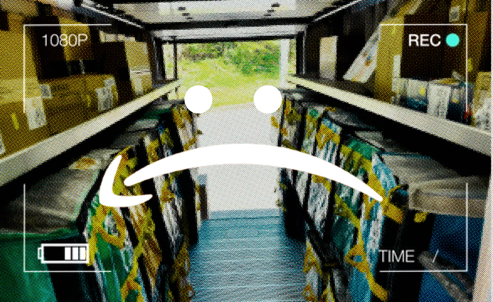 A grainy image of packages lined up in the back of an Amazon delivery truck, superimposed on the top is a frame that looks like we are seeing it through a surveillance camera. On top of the middle of the image is an inverted Amazon logo that looks like a frowny face