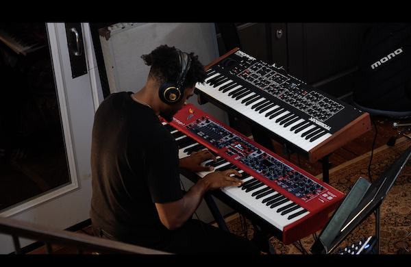 Dayne Reliford with both hands on his trusty Nord Stage keyboard