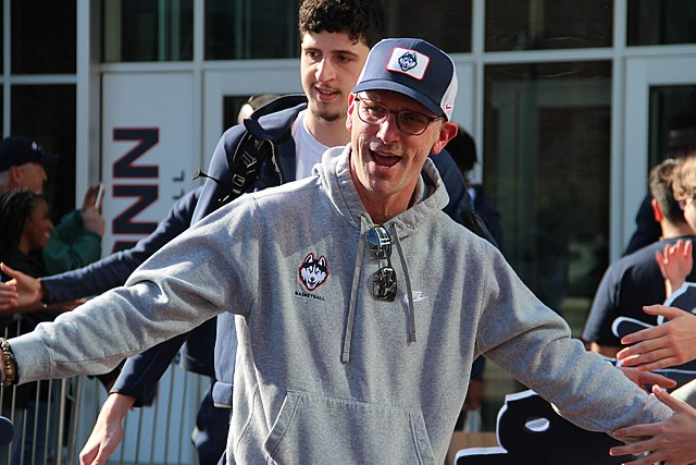 a man in a hat and a hoodie