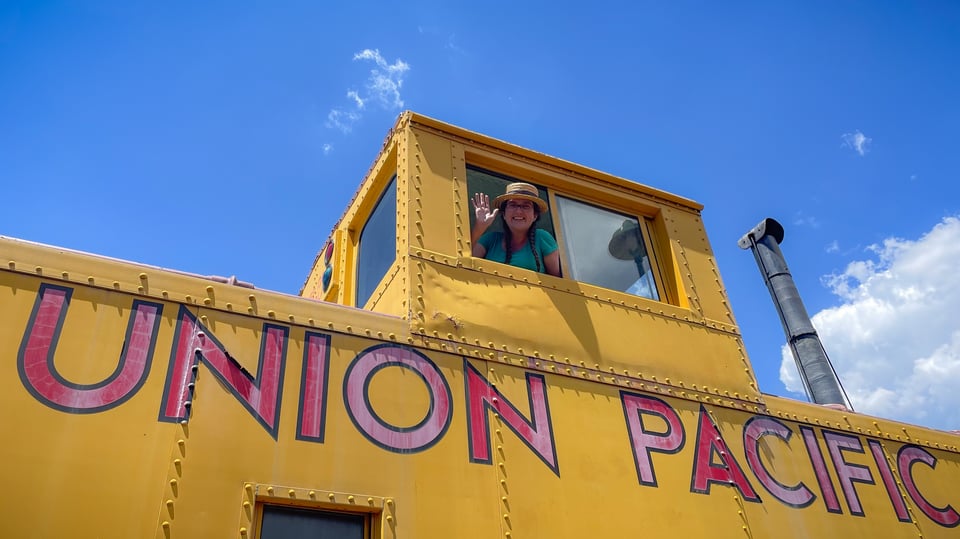 Captain Lark, waving from a caboose