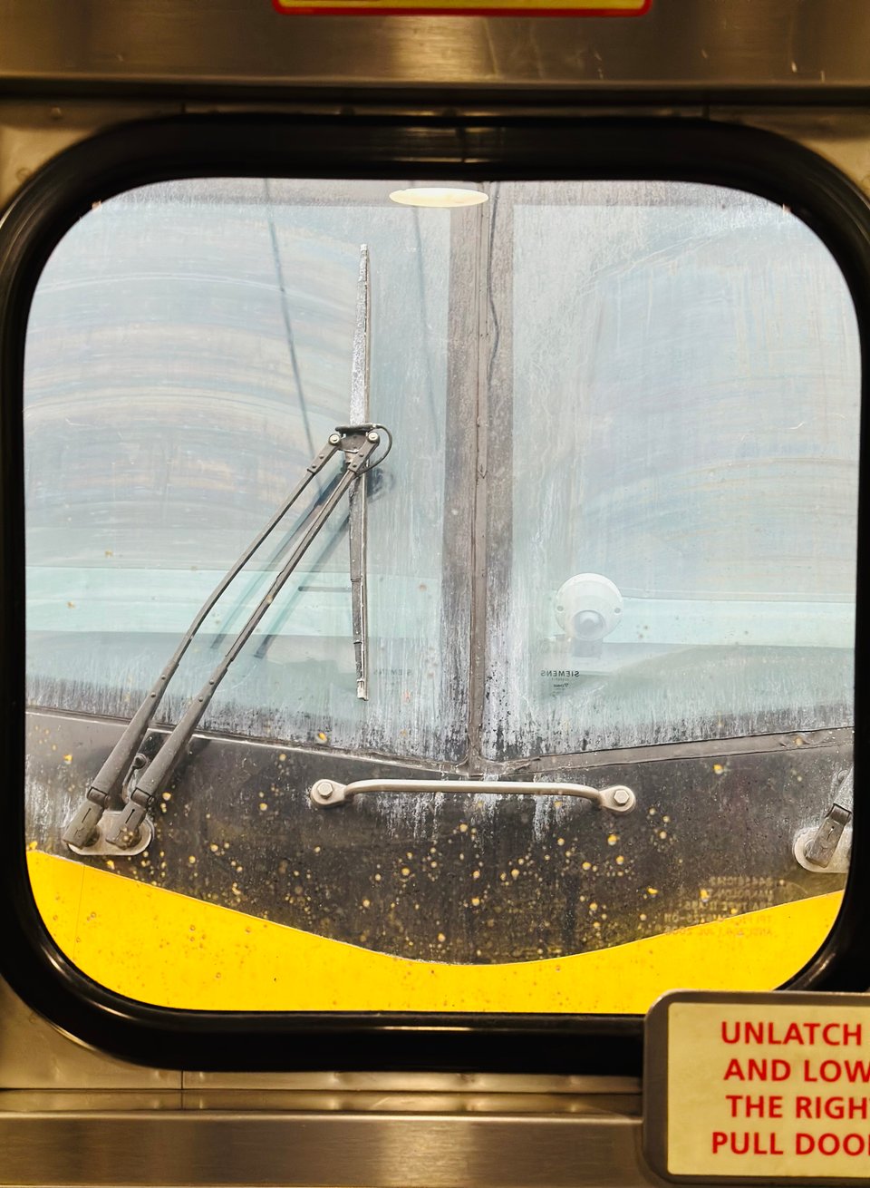 Photo of train window looking forward at locomotive window