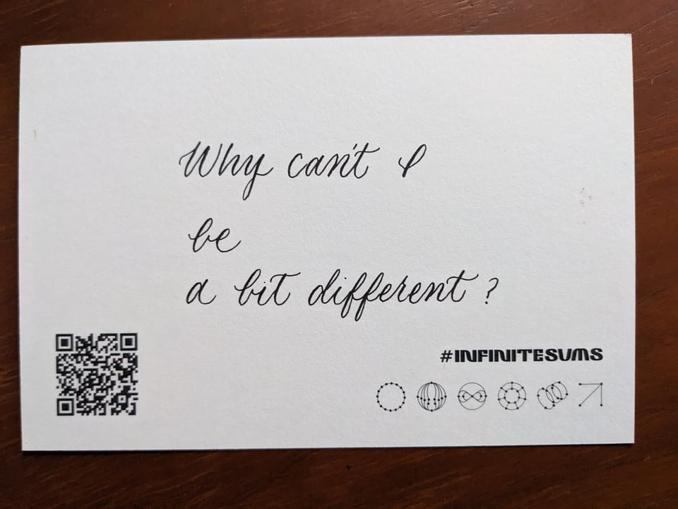 a postcard that has a poem in calligraphy "Why can't I / be / a bit different?"