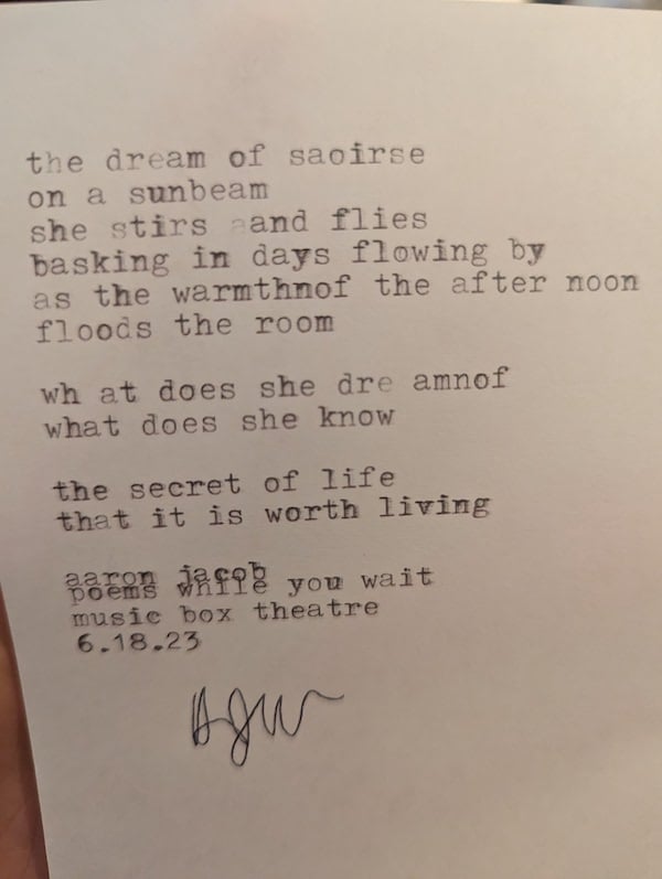 A photo of a poem called "the dream of saoirse" set in type on a white sheet of paper