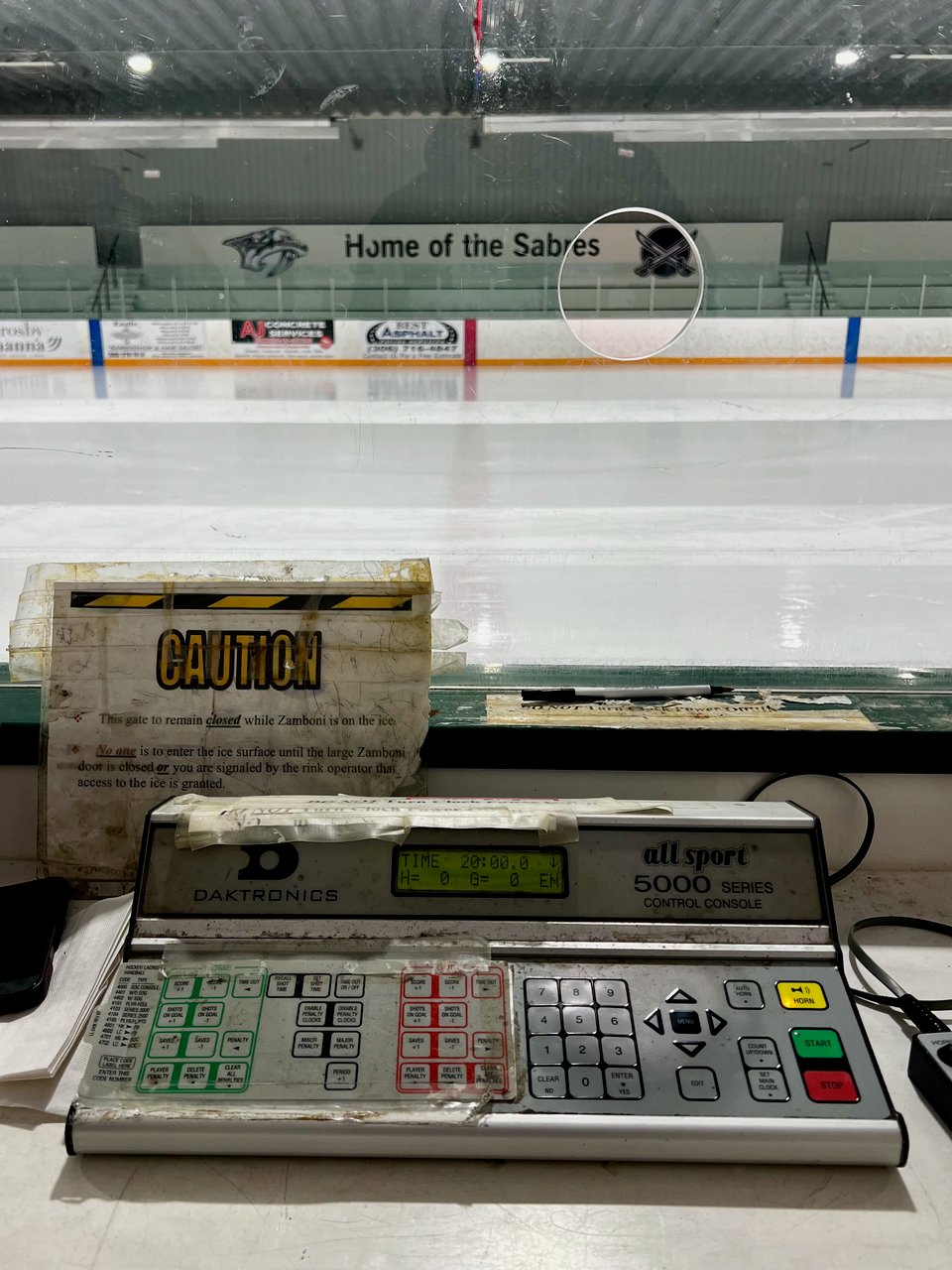A photo of a scoreboard updating box at a small town hockey rink. The All Sport 5000 series.
