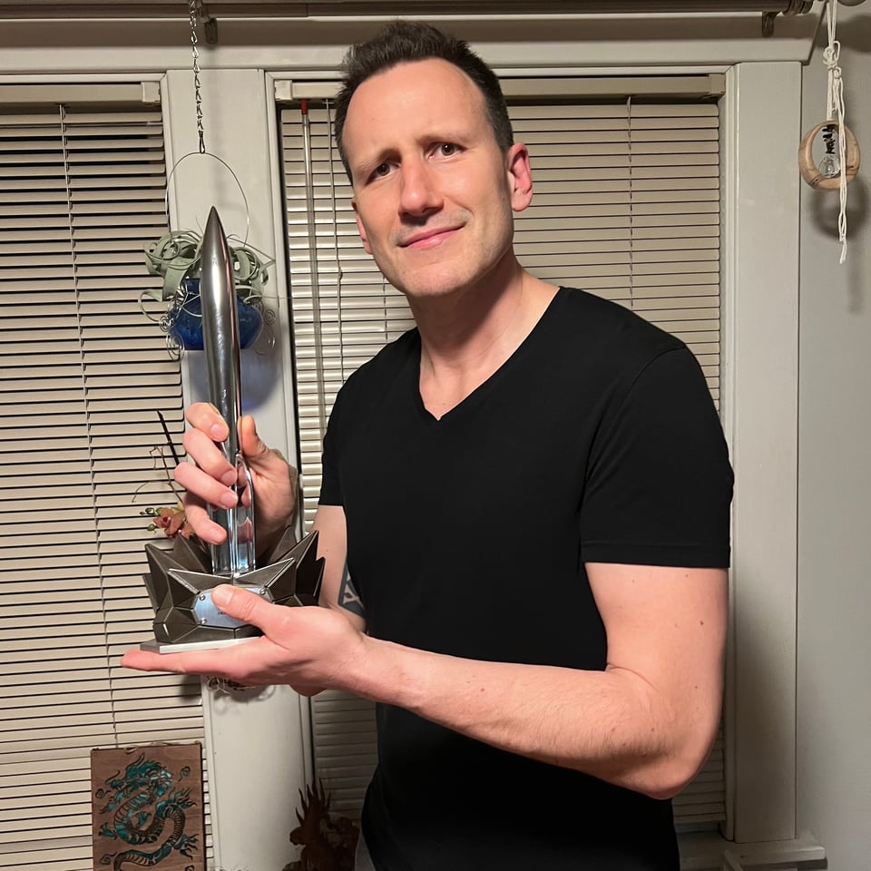 Me posing with Helen Montgomery’s Hugo Award.