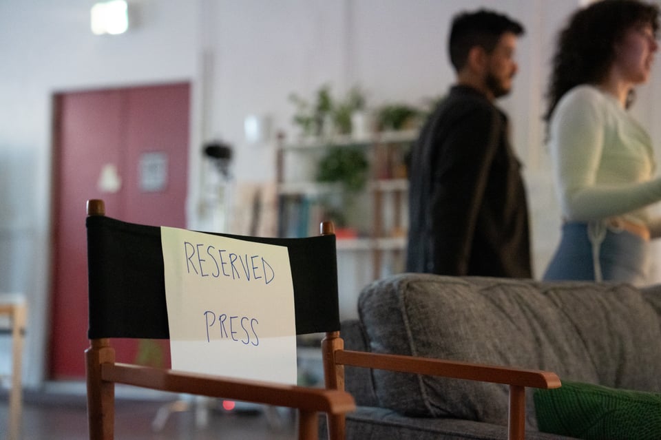 A chair with a sign on it.