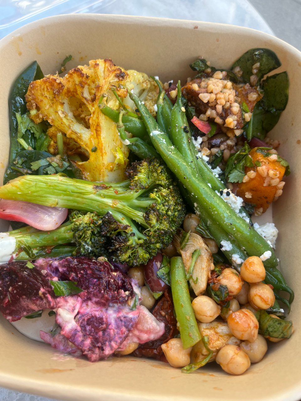 Various vegetable salads in compostable dish