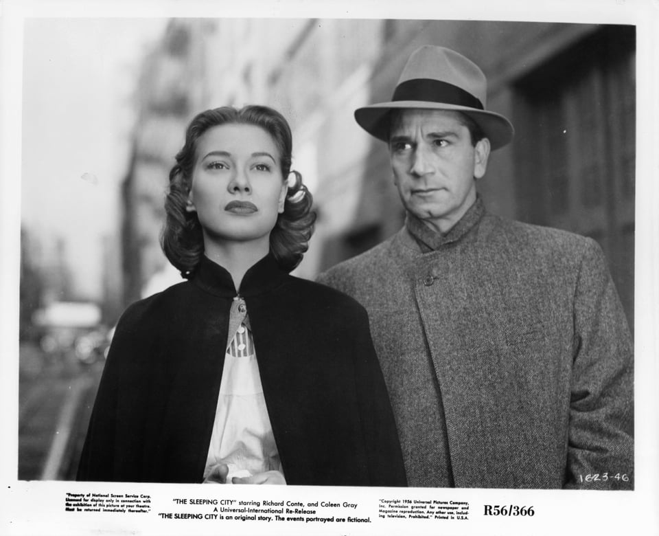 Still from The Slepeing city featuring a man and woman outside Bellevue Hospital