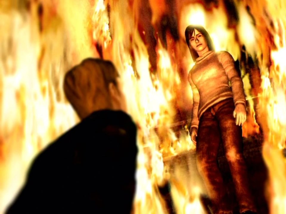 James looking up at Angela surrounded by flame