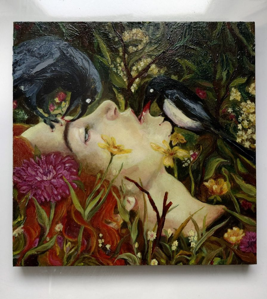 An oil painting showing the profile of a dead woman's face. She is laying amongst green and yellow grasses, with several different flowers growing around her, giving the impression she has been there for a while. Her hair is red. There is a crow nibbling her eyebrow, and a magpie perches on her chin with her lip clasped in its beak. The woman's skin is green tinged. One half open clouded eye looks out at the audience