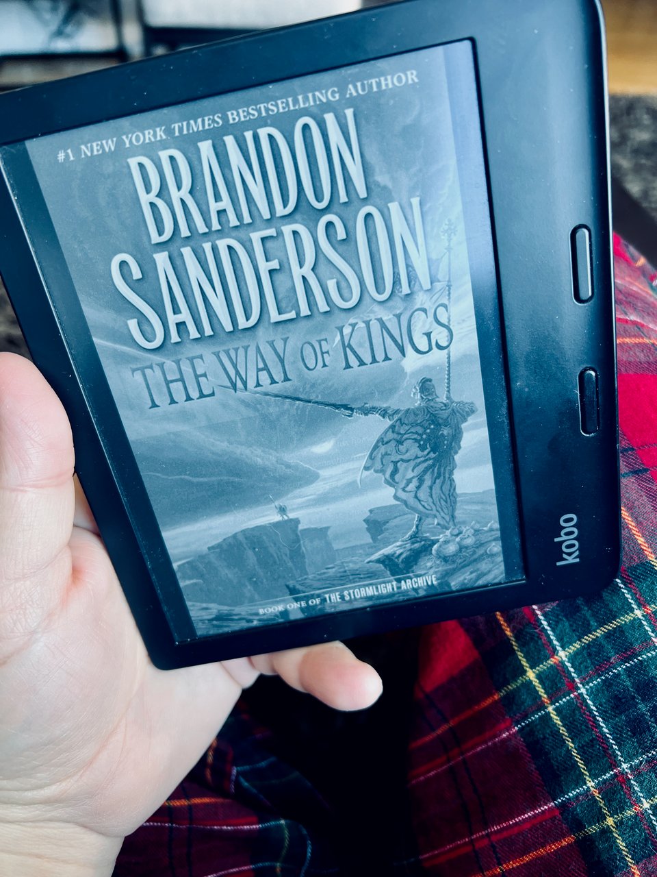 Photo of a kobo e-reader with Brandon Sanderson's The Way of Kings on the cover.