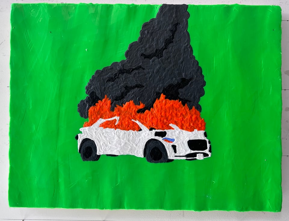 Painting of a Waymo on fire in progress.