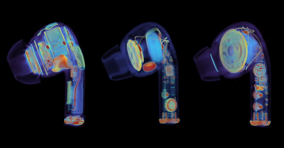 On a black background there are three close-up images of Airpod-style earbuds. They appear to be x-rays -- the external shell of the earbuds is dark-to-invisible against the back background, while the internal electronics glow in blue, yellow, orange and red