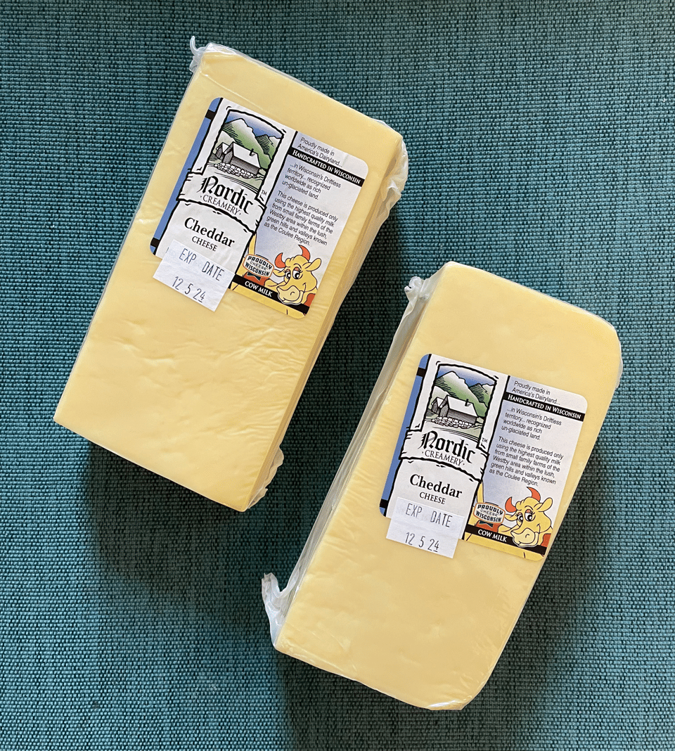 Two large blocks of cheese