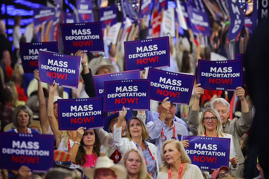 Smiling RNC delegates with “Mass Deportation Now!” signs