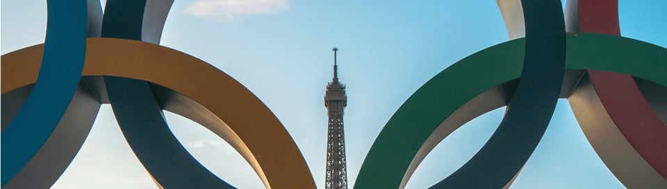 The Eiffel Tower viewed through massive Olympic rings