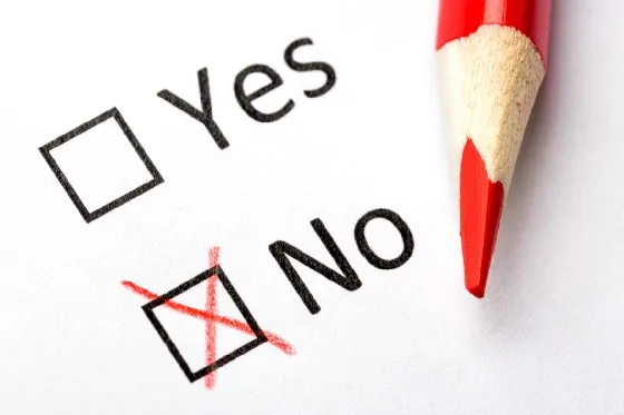 a red pencil next to a check mark with yes or no option