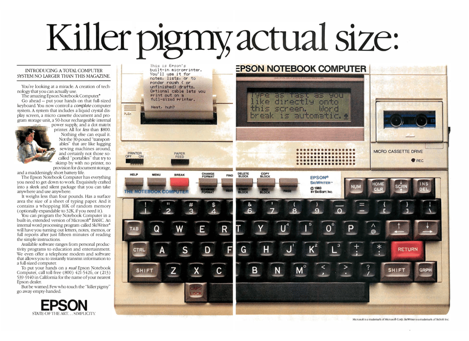 A closeup photo of the HX-20 computer. There is a small amount of text printed on paper to the left of the laptop's small LCD screen. The headline reads "Killer pigmy, actual size."