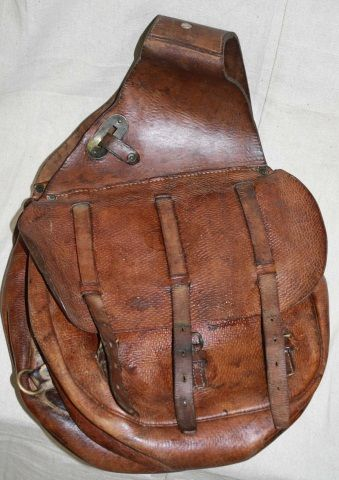 a leather saddlebag, inside a side pocket, deeds, possibly make a man rich