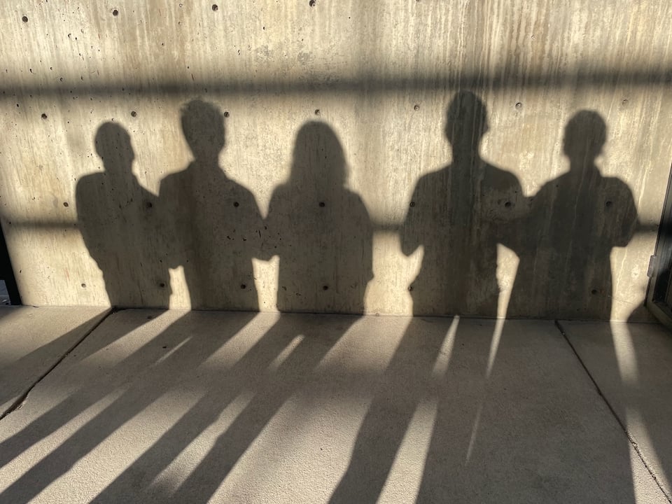 Silhouettes on a wall.