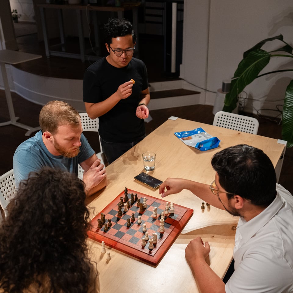 José and Trevr playing an intense match of chess.