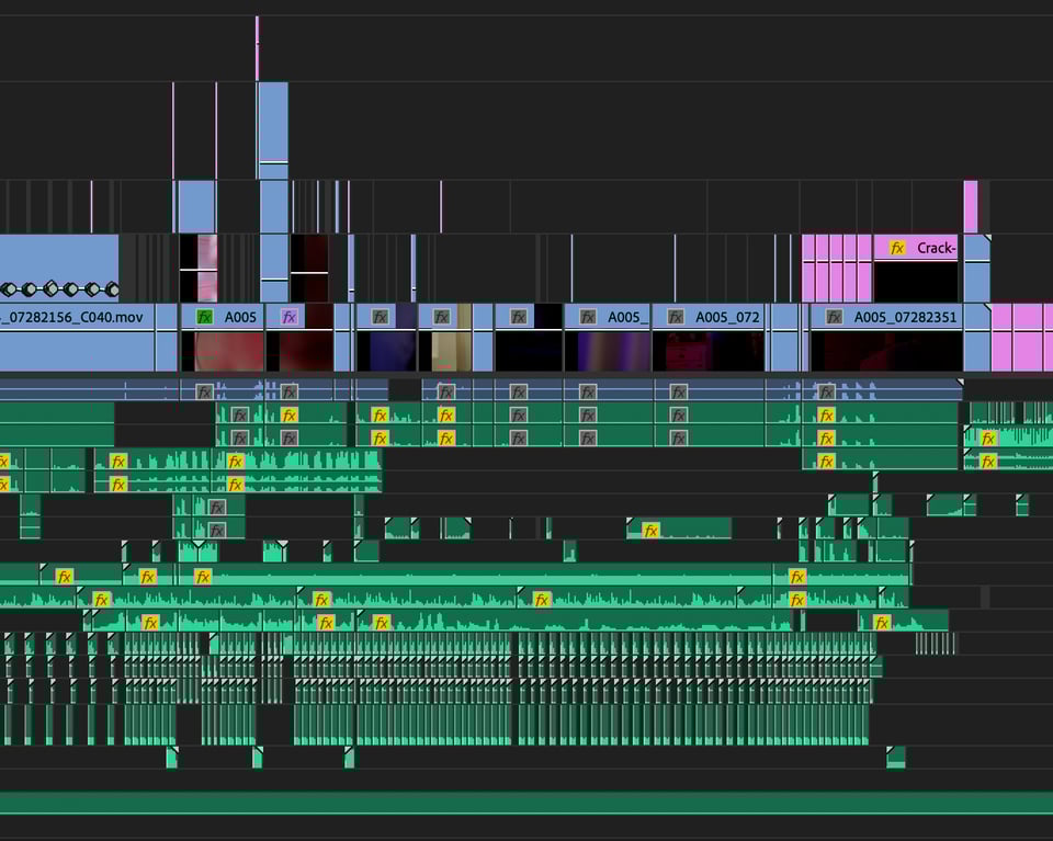 A timeline in a film software editing program. Both the visual clips and the audio clips are densely packed